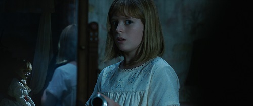 (L-R) The Annabelle doll and LULU WILSON as Linda in New Line Cinema's supernatural thriller ANNABELLE: CREATION, a Warner Bros. Pictures release. Courtesy of Warner Bros. Pictures, © 2017 WARNER BROS. ENTERTAINMENT INC. AND RATPAC-DUNE ENTERTAINMENT LLC.