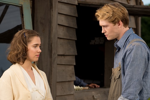 Haley Lu Richardson (left) stars as Sylvia Hermann and Joe Alwyn (right) stars as Klaus Eichmann in OPERATION FINALE, written by Matthew Orton and directed by Chris Weitz, a Metro Goldwyn Mayer Pictures film. Credit:  Valeria Florini / Metro Goldwyn Mayer Pictures © 2018 Metro-Goldwyn-Mayer Pictures Inc. All Rights Reserved.