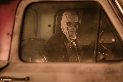 Man in the Mask (Damian Maffei) stalks his unsuspecting victims in THE STRANGERS: PREY AT NIGHT. Photo credit: Brian Douglas / Aviron Pictures.