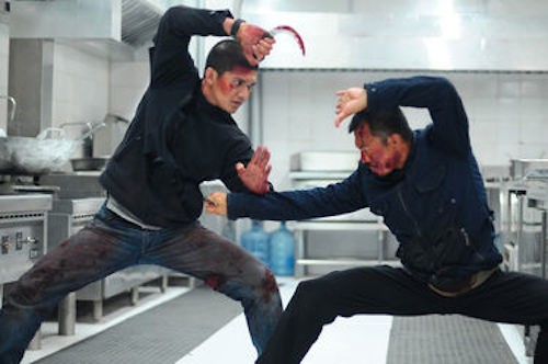 Iko Uwais as Rama and Cecep Arif Rahman as The Assassin in The Raid 2. 2014 Sony Pictures Classics.