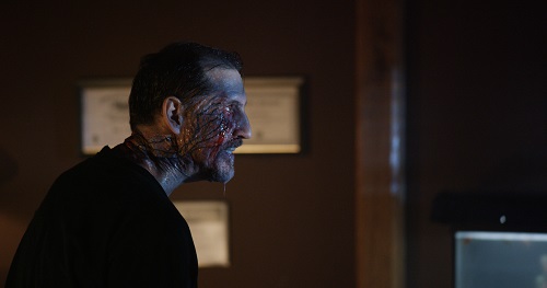 John Speredakos as Dr. Michael Slovak in the horror film THE MIND'S EYE, an RLJ Entertainment release. Photo credit Joe Begos.